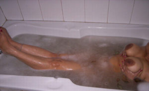 busty hottie taking bath