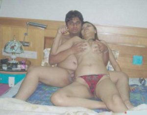 Desi Couple horny nude in bed big boobs pic